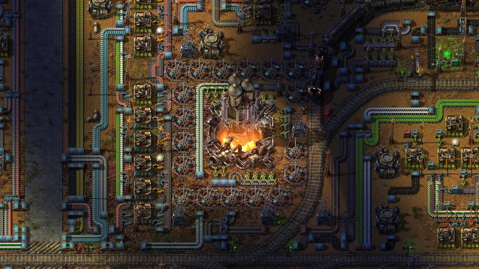 Fábrica em Factorio vista de cima, com esteiras, tubulações, máquinas e um foguete sendo lançado no centro.